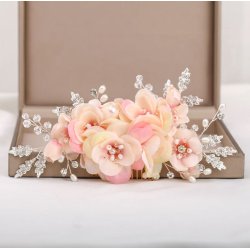 H�rkam med rosa stofblomster og krystaller