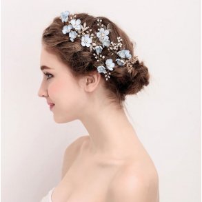 Hrkam med bl blomster